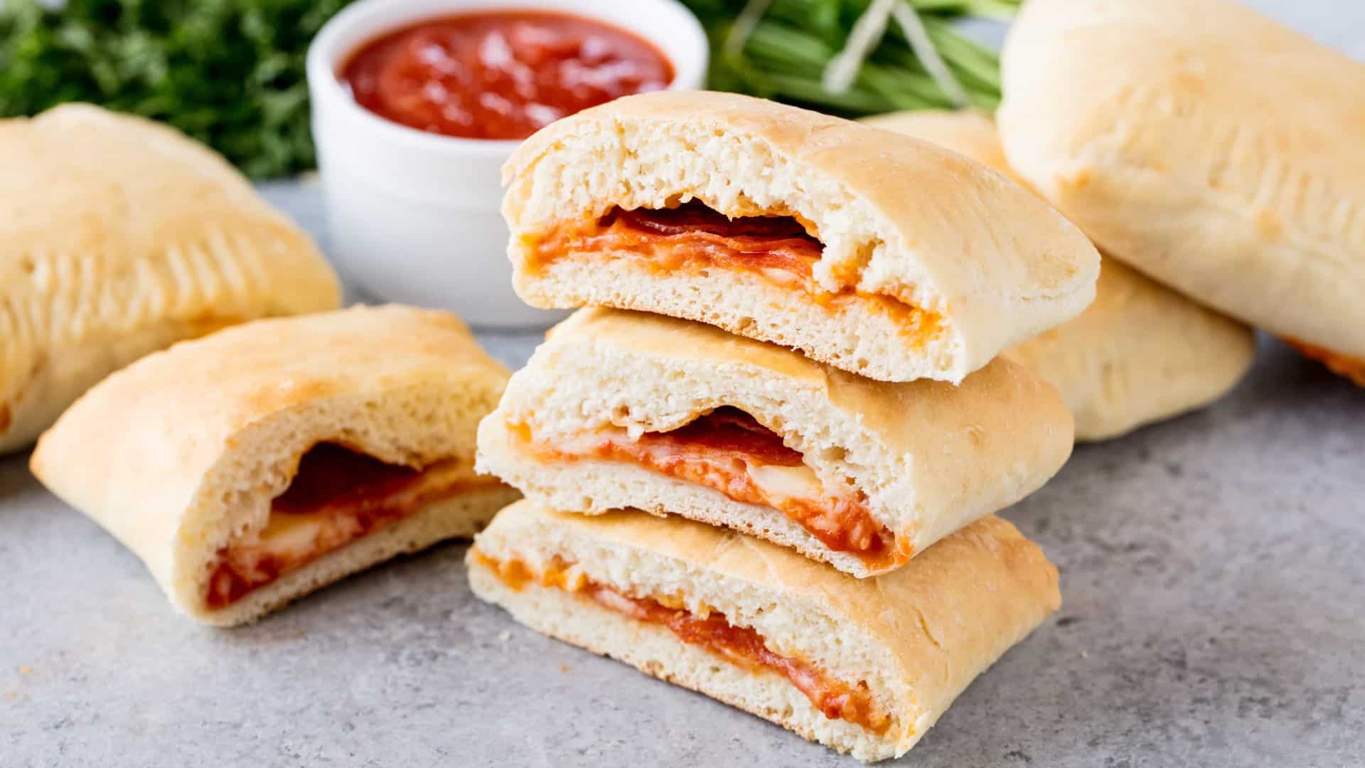 Homemade Hot Pockets are an easy homemade freezable lunch idea. They are perfect for an on-the-go meal, as well as to put in lunch boxes. The flavor combinations are endless!