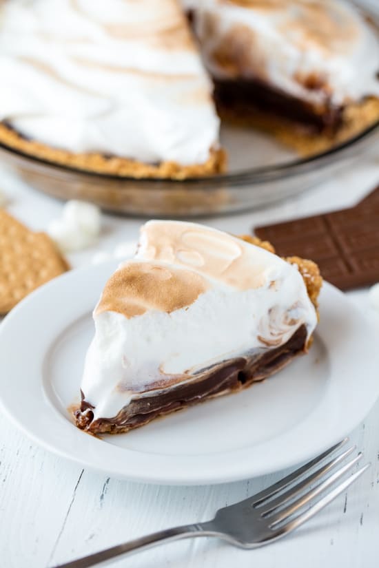 A slice of homemade s'mores pie on a plate