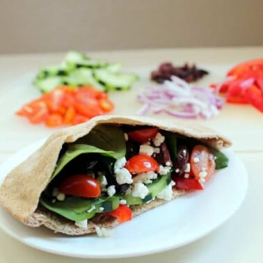 Greek Pita stuffed with cheese, tomato, onion, and other vegetables.