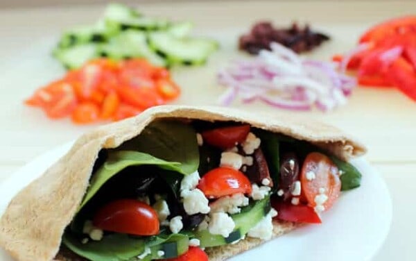 Greek Pita stuffed with cheese, tomato, onion, and other vegetables.