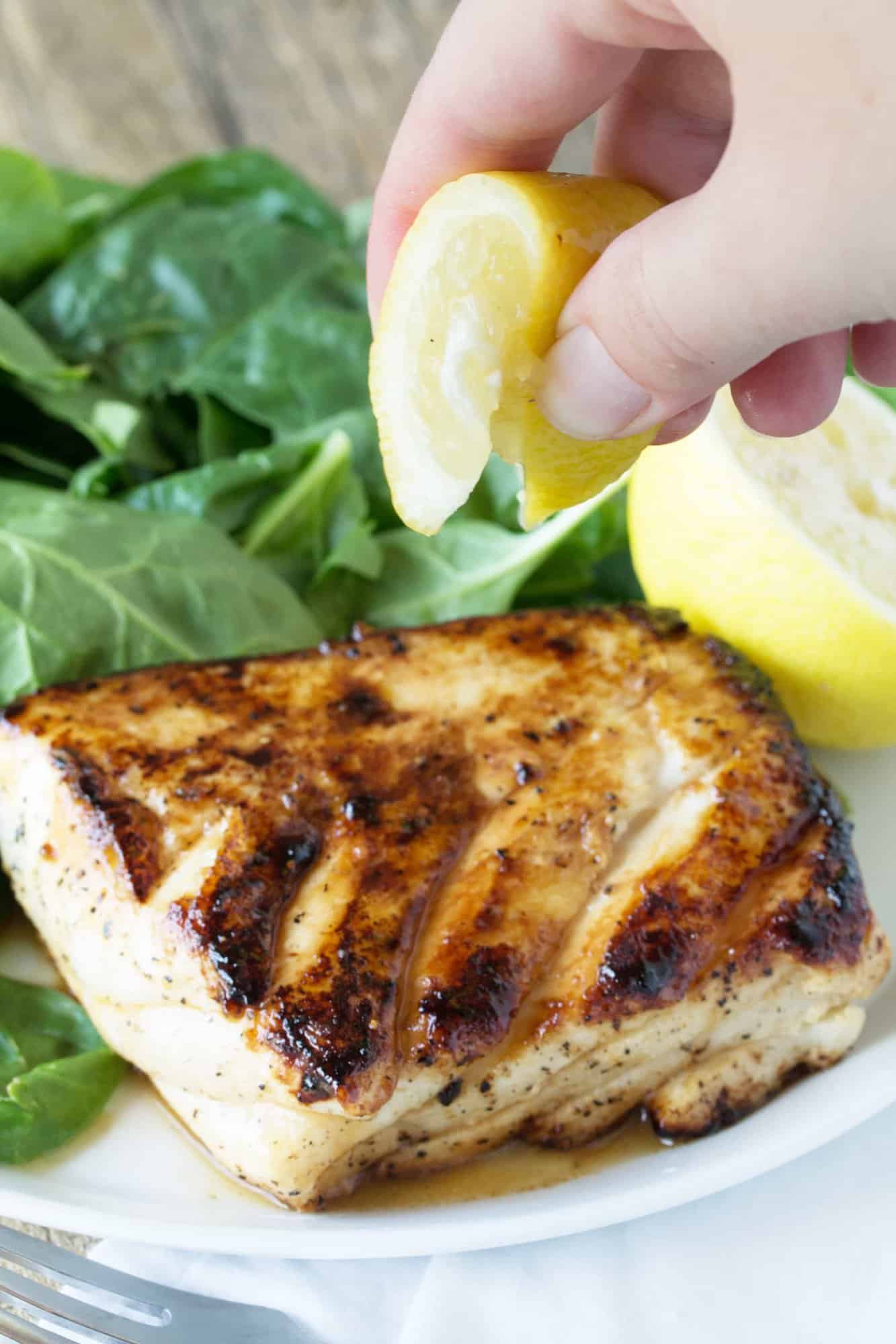 Enjoy a healthy and delicious meal ready in just minutes! Easy and delicious grilled halibut with honey and lemon will have you falling in love with fish for the first time, or all over again!