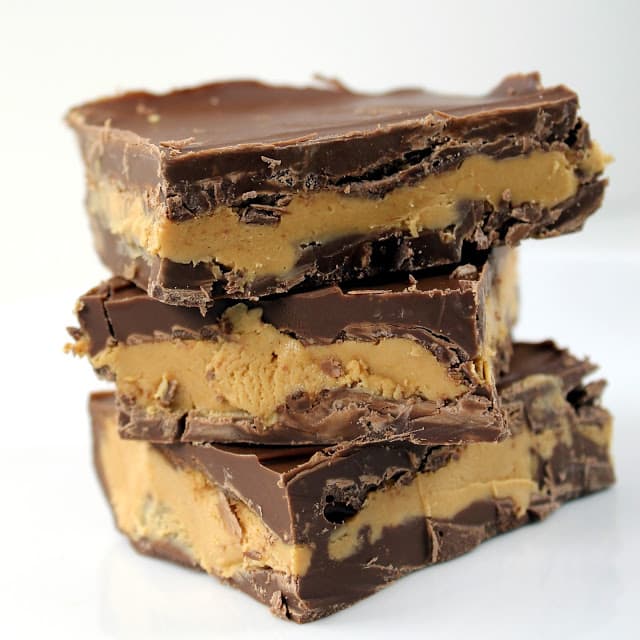 A stack of Chocolate Peanut Butter Bars layered with peanut butter and chocolatey goodness