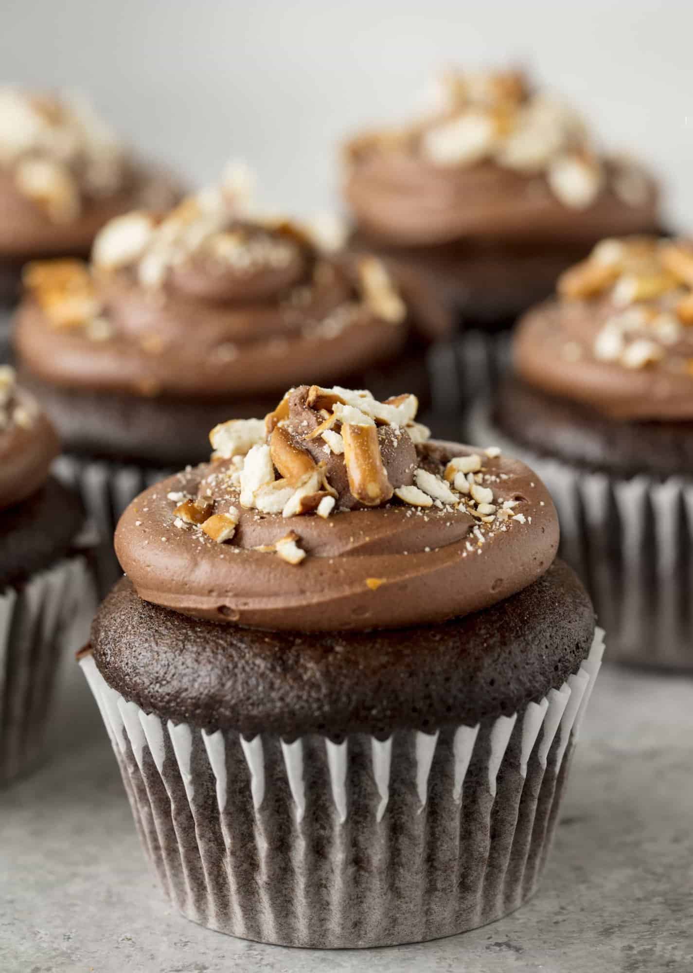 Sinfully decadent chocolate cupcakes filled with a creamy peanut butter filling and topped with whipped chocolate ganache and crushed pretzel. These Chocolate Peanut Butter Pretzel Cupcakes are out of this world!
