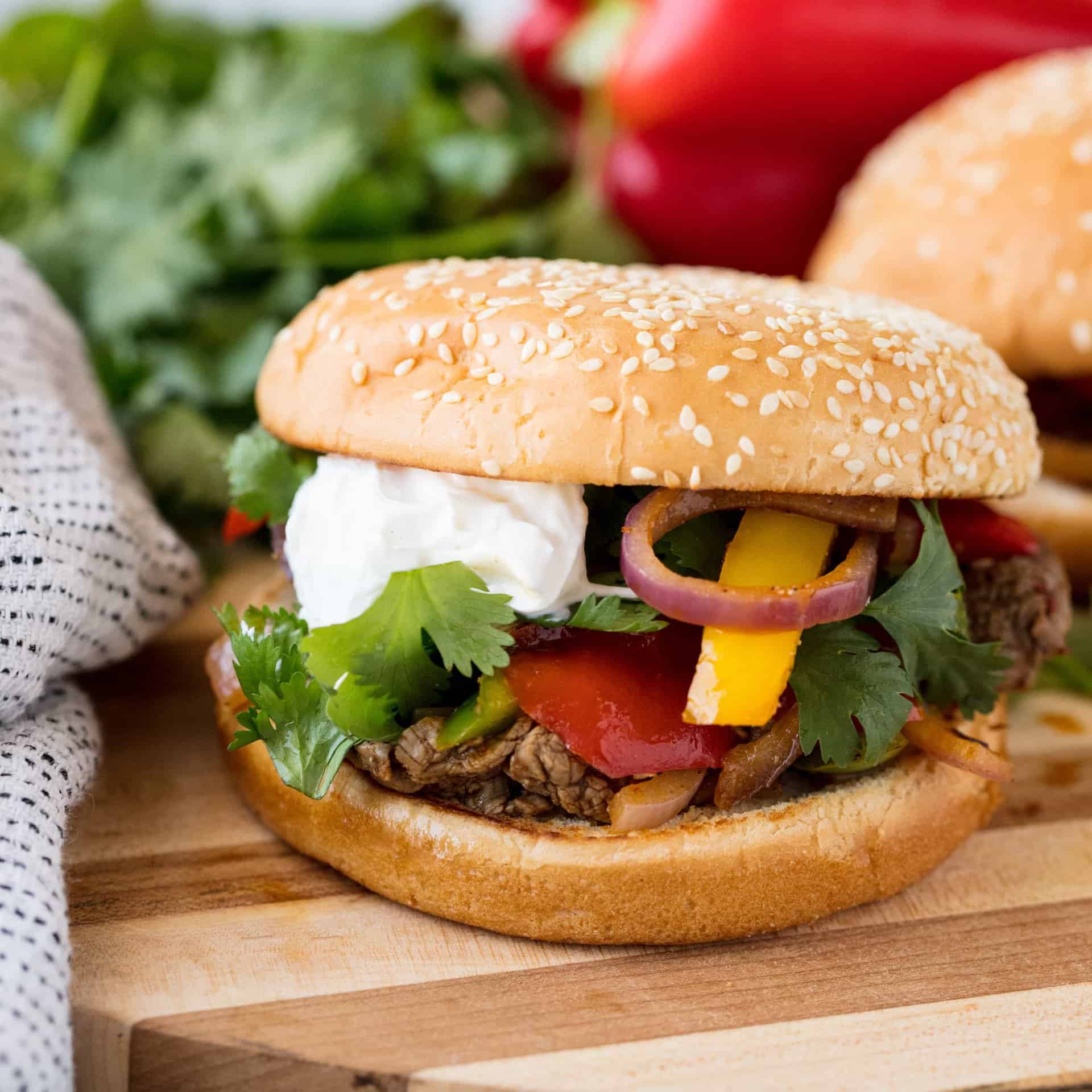Fajita Burgers take all the flavors of fajitas that you love and combines it into a delicious burger that's perfect for any backyard barbecue!
