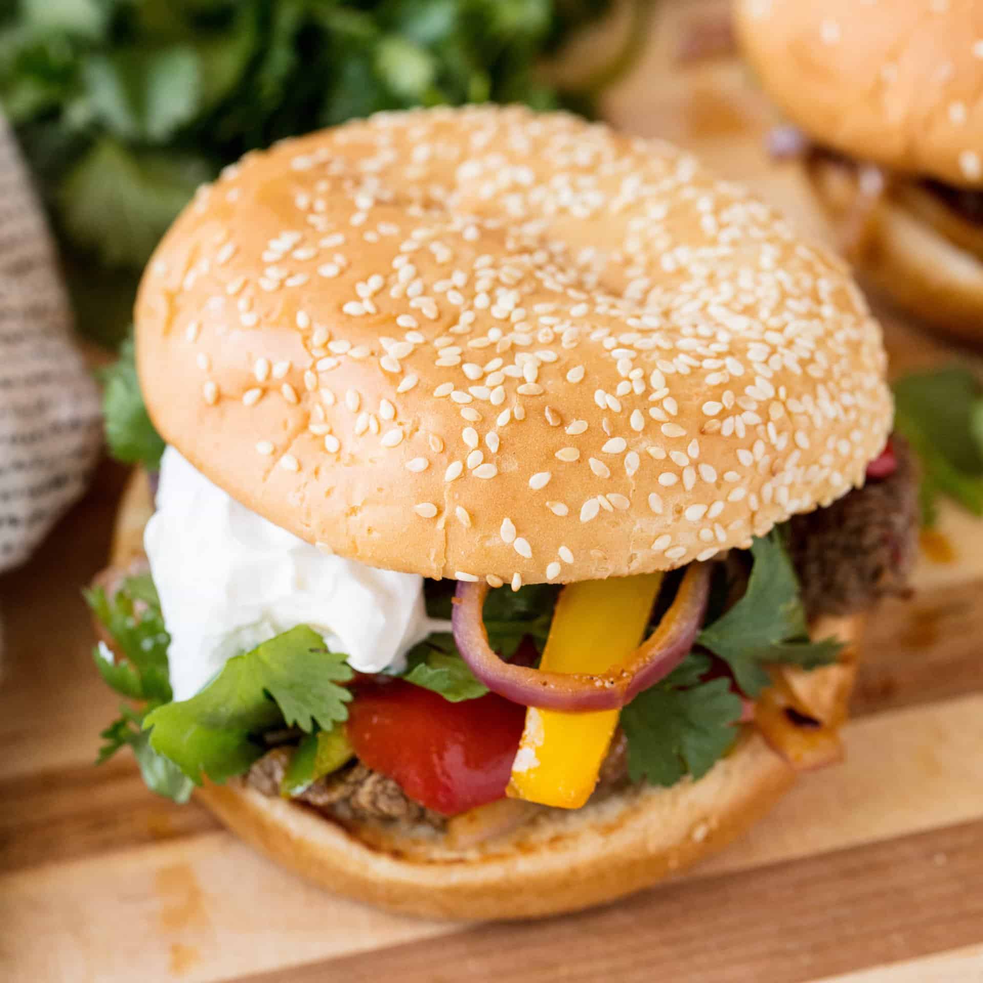 Fajita Burgers take all the flavors of fajitas that you love and combines it into a delicious burger that's perfect for any backyard barbecue!