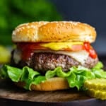 A close up view of a perfectly plump and juicy American hamburger.