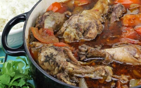 Caribbean Chicken in a blue cooking pot.