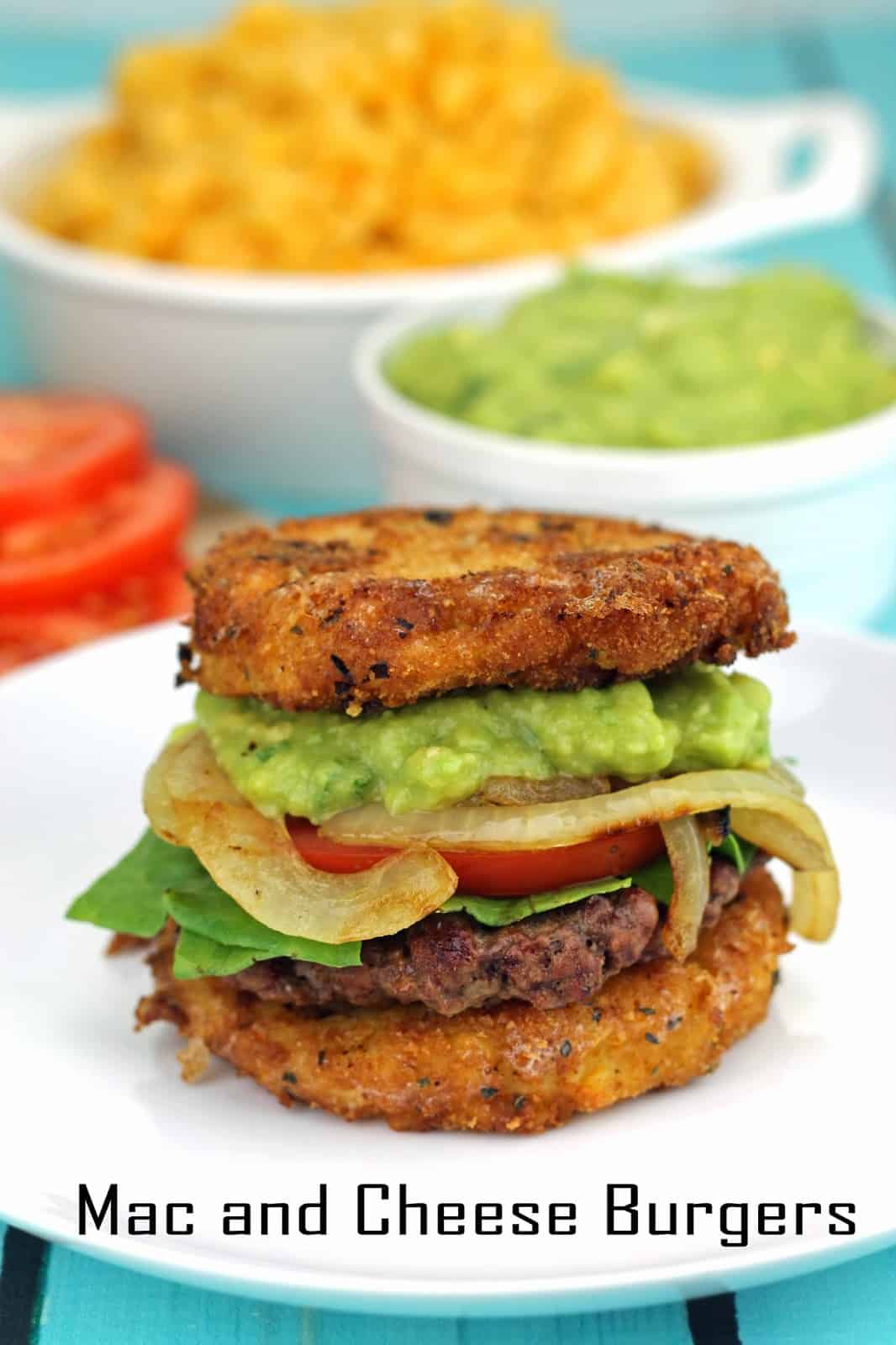 Mac and Cheese Burgers with Guacamole and Grilled Onions sitting on a white plate.