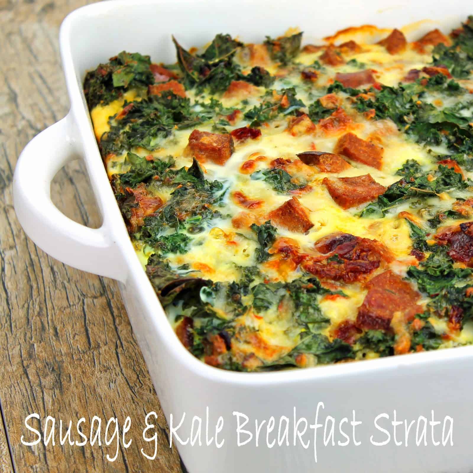 Close up of Sausage and Kale Breakfast Strata in a white baking dish.