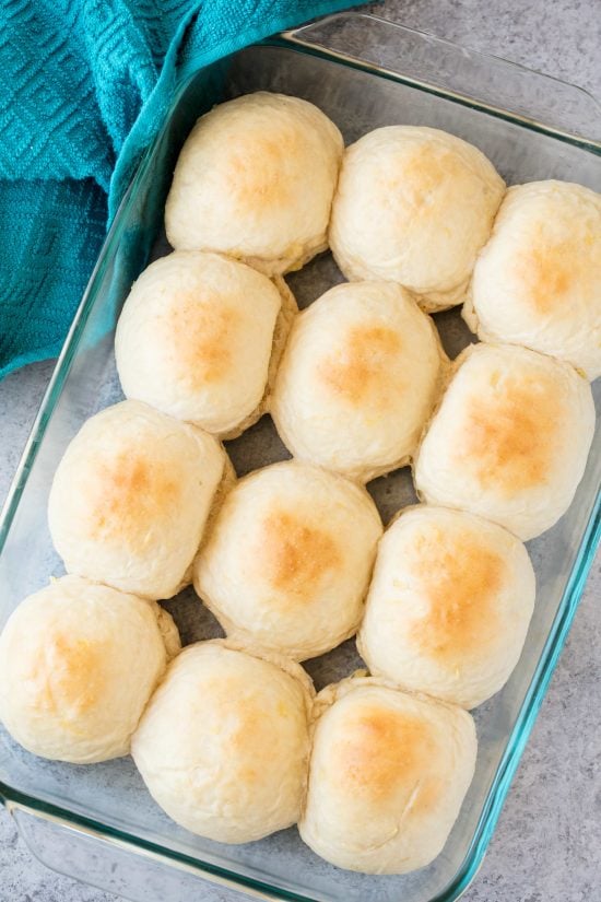 A pan of Homemade Hawaiian Sweet Rolls fresh out of the oven with lightly golden tops