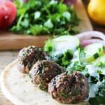 Juicy ground lamb meatballs are drizzled with lemon Lamb Meatball Gyros