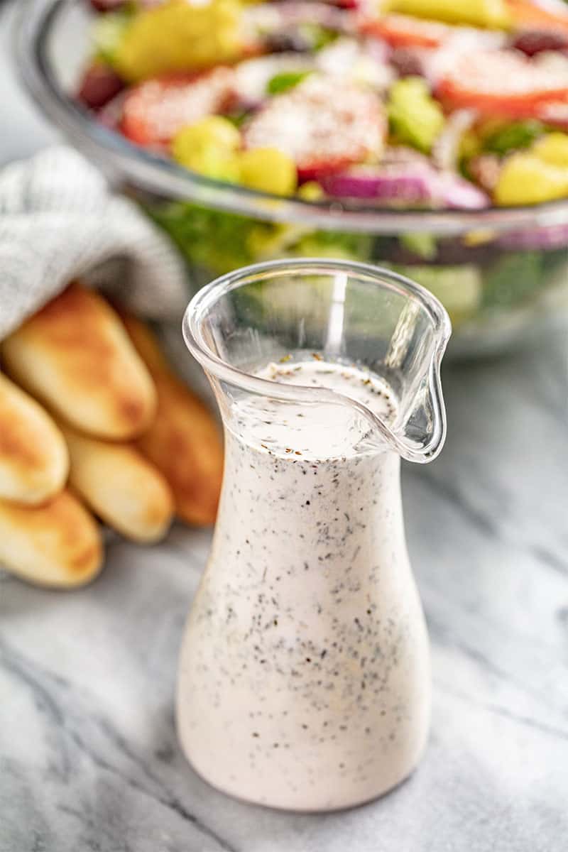 Salad Dressing in a small glass pitcher.