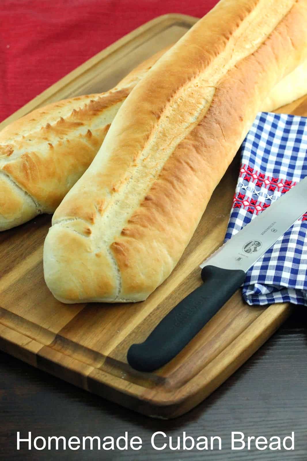 Loaves of fresh DIY Homemade Cuban Bread on a cutting board