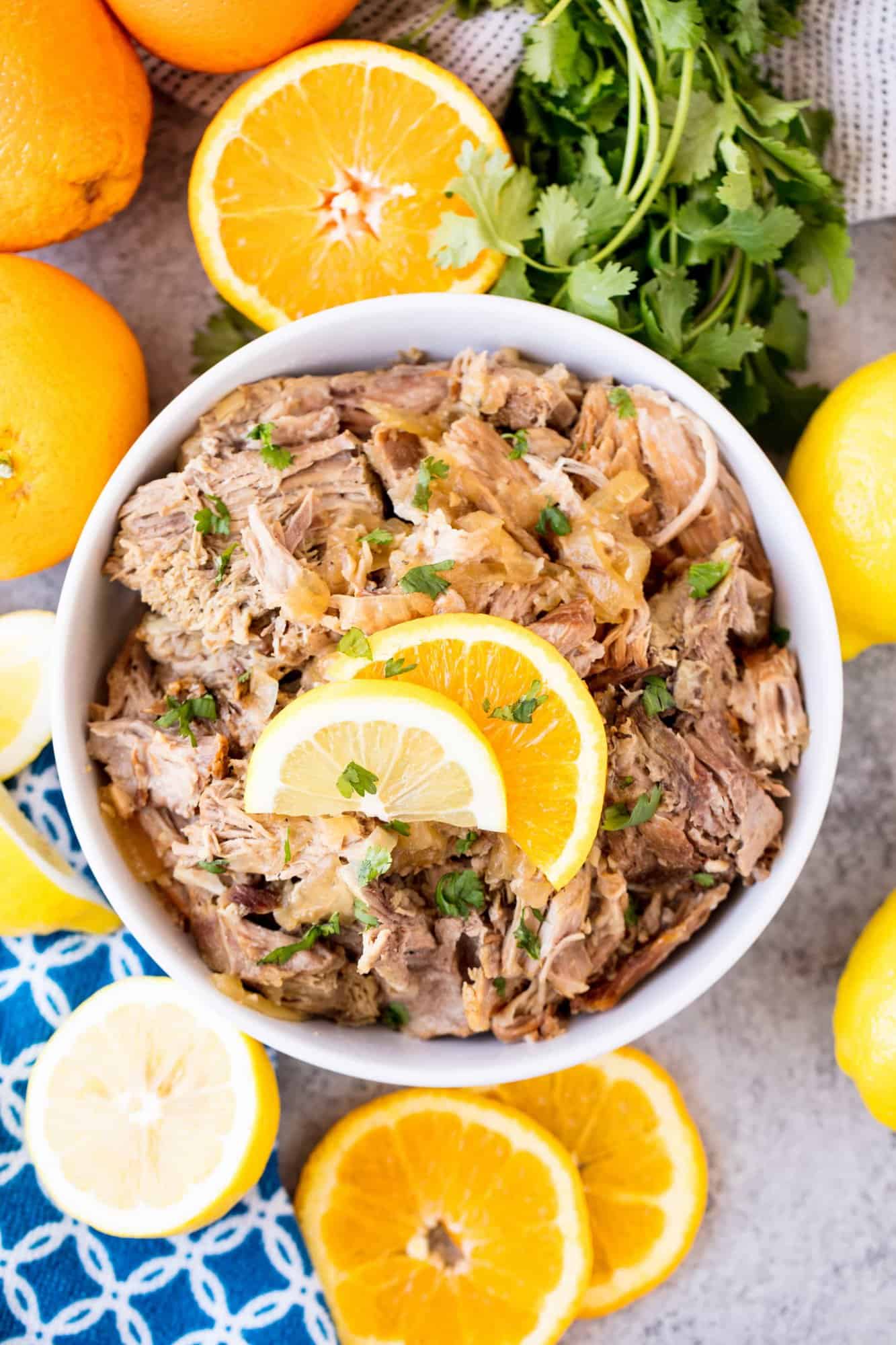 Slow Cooker Cuban Mojo Pork is tender shredded pork, slow cooked in a garlic citrus sauce. Serve it up on some toasted bread for a delicious Cuban sandwich or plain with rice and beans.