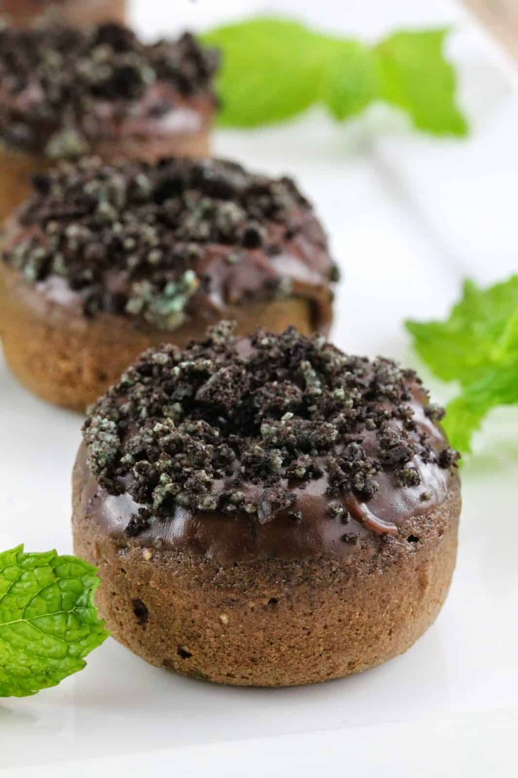 Baked chocolate donuts with mint frosting