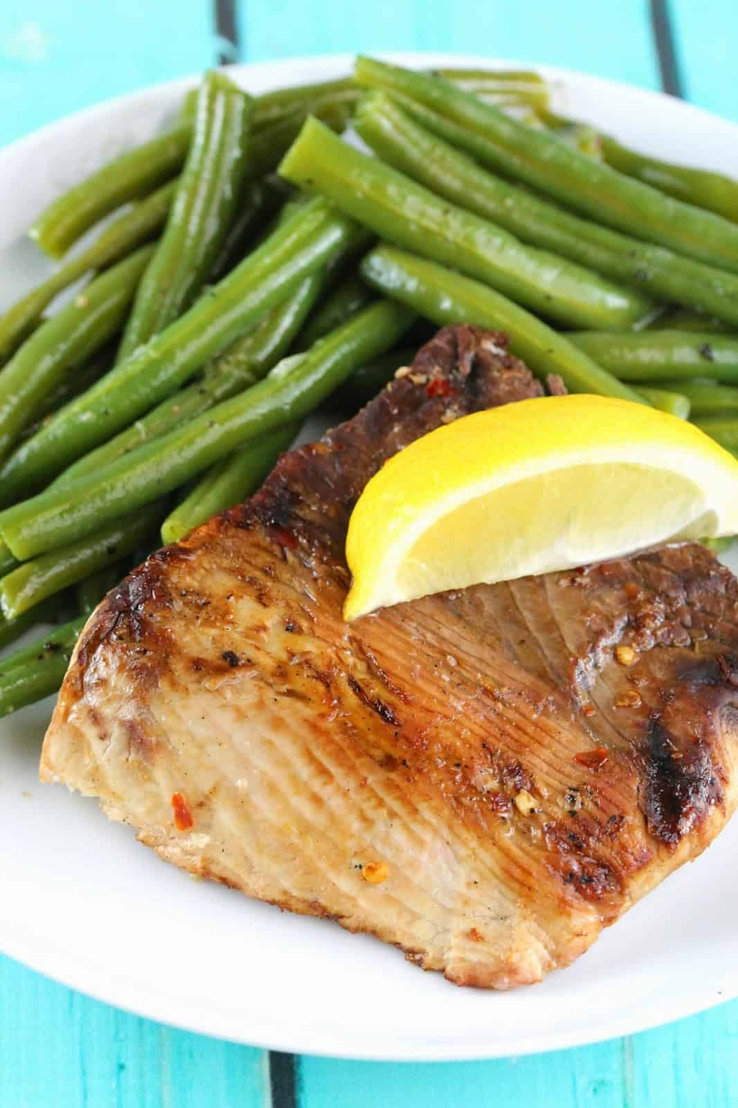 Thresher Shark served with green beans and topped with a fresh lemon wedge: A nice, steaky, meaty fish that makes you feel like you have conquered the ocean.