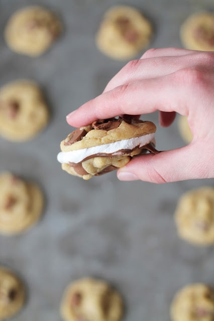 Nutella and marshmallow cream sandwiched between two chocolate chip cookies.