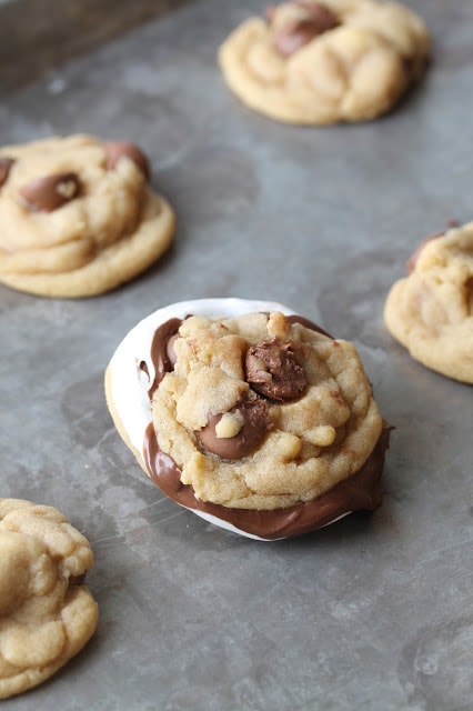 Nutella cream chocolate chip sandwich cookies on a sheet pan