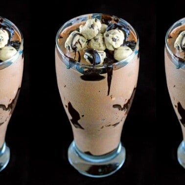 Three double fudge chocolate chip cookie dough shakes with a black background