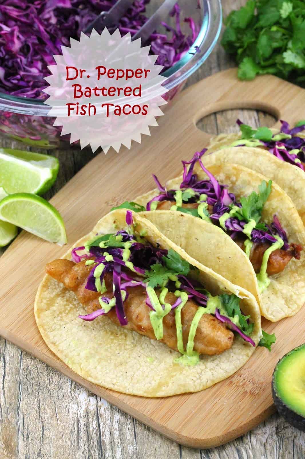 Dr. Pepper Battered Fish Tacos: Dr. Pepper battered fish is wrapped in warm corn tortillas and topped with fresh cabbage slaw, avocado crema and garnished with cilantro and lime wedges.