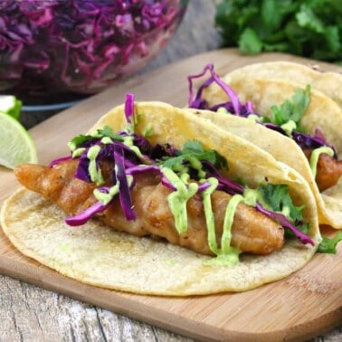 Dr Pepper Battered Fish Tacos on a cutting board.