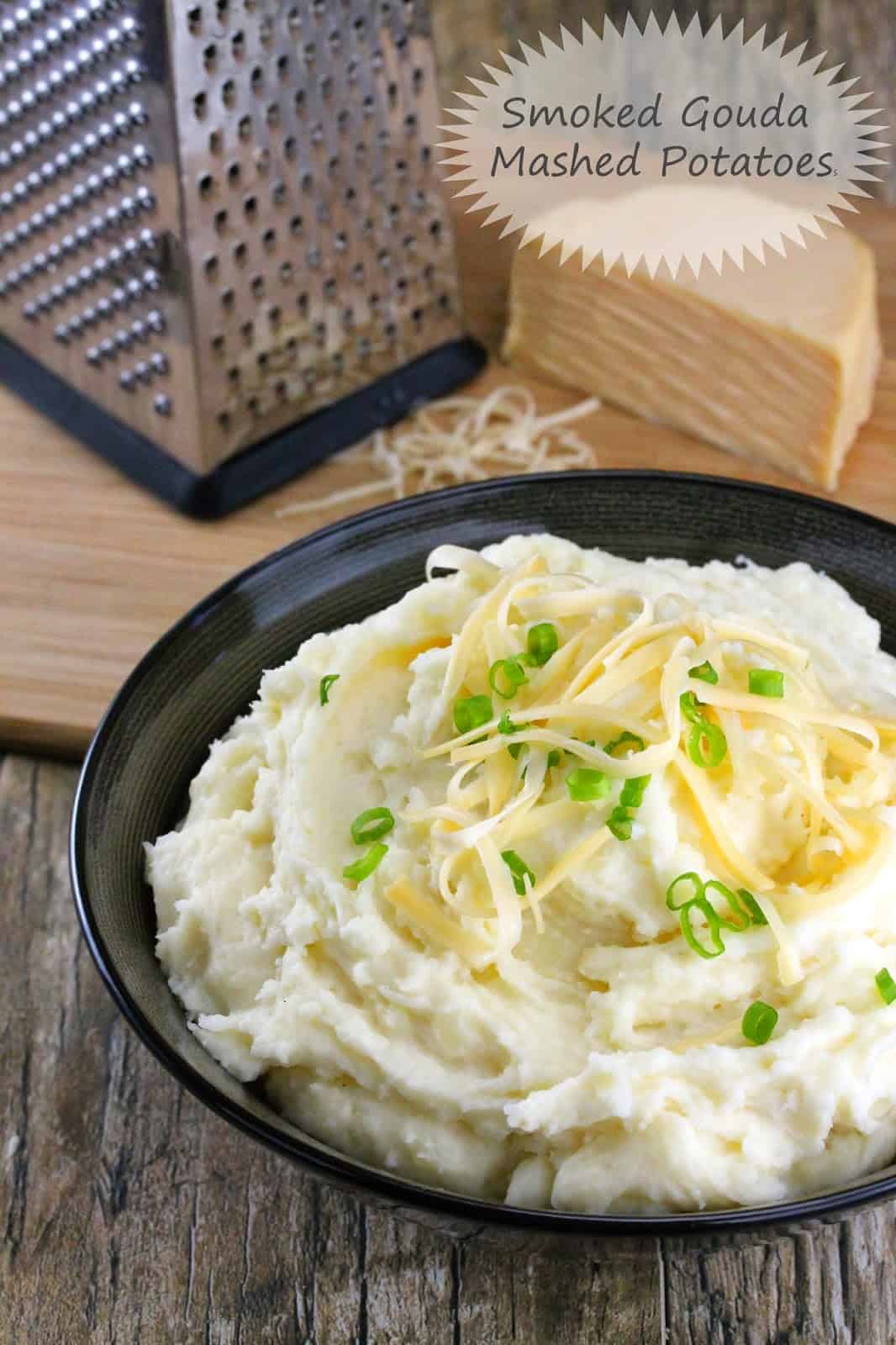 Smoked Gouda Mashed Potatoes served up with some freshly grated smoked gouda and chopped green onion