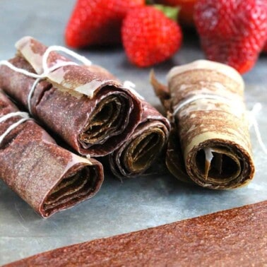Strawberry Nectarine Fruit Leather wraps on a table top.