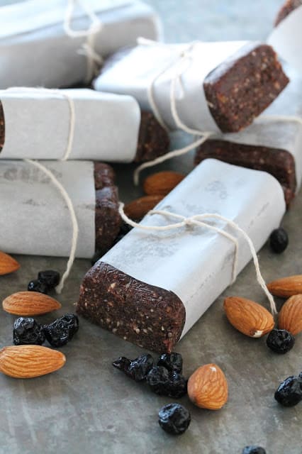 Superfood Protein Energy Bars wrapped in parchment paper and tied with string. These bars are packed with 7 different superfoods!