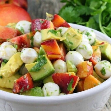 Nectarine and Avocado Fruit Salad in a white bowl.