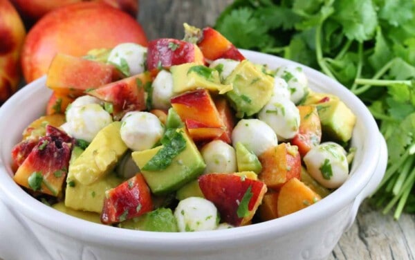 Nectarine and Avocado Fruit Salad in a white bowl.