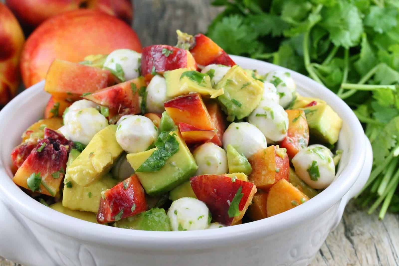 Nectarine and Avocado Fruit Salad in a white bowl.