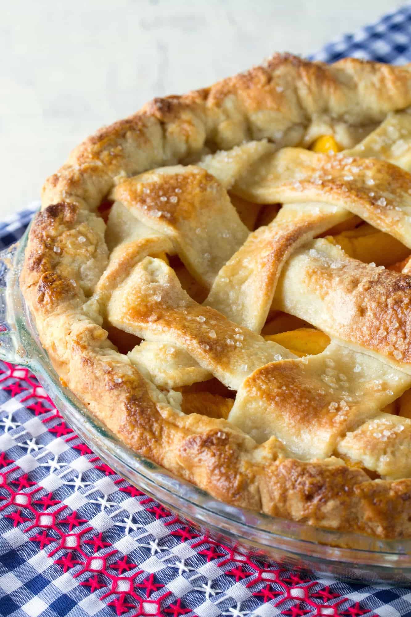 The perfect peach pie is within your grasp. A vibrant, sweet peach filling surrounded by a perfect fail-proof crust. It's all about the secret ingredient.