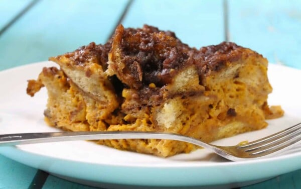 Slow Cooker Pumpkin French Toast on a white plate with a fork.