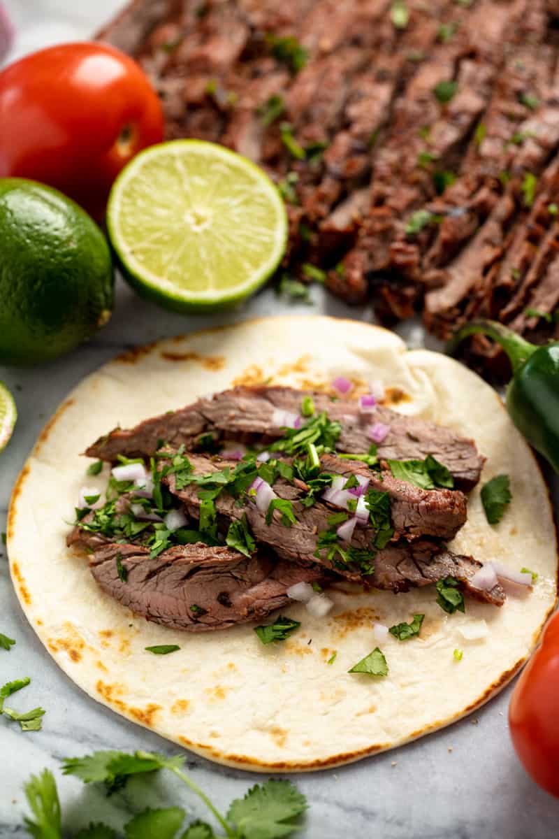 Marinated flank or skirt steak is grilled to perfection for the best Authentic Carne Asada Authentic Carne Asada