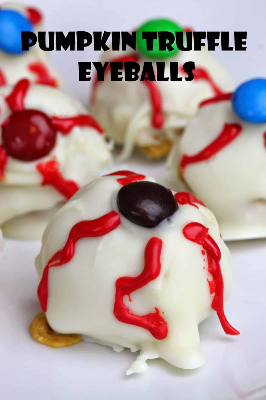 Pumpkin Truffle Eyeballs with the text "Pumpkin Truffle Eyeballs" above them.