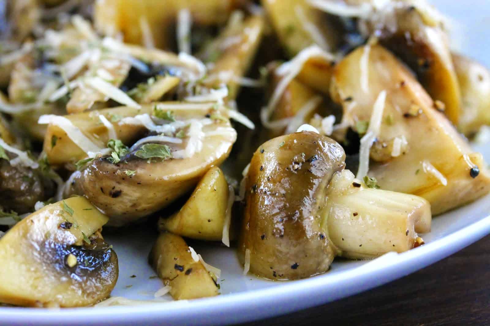 Sauteed Mushrooms on a white plate.