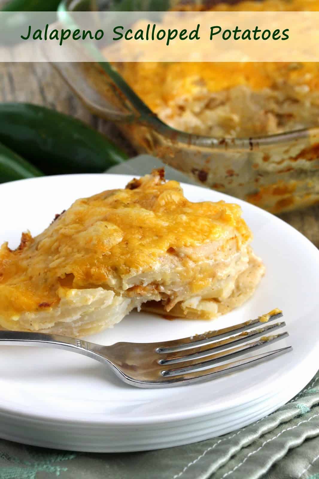 Served up jalapeno scalloped potatoes on a stack of white plates.