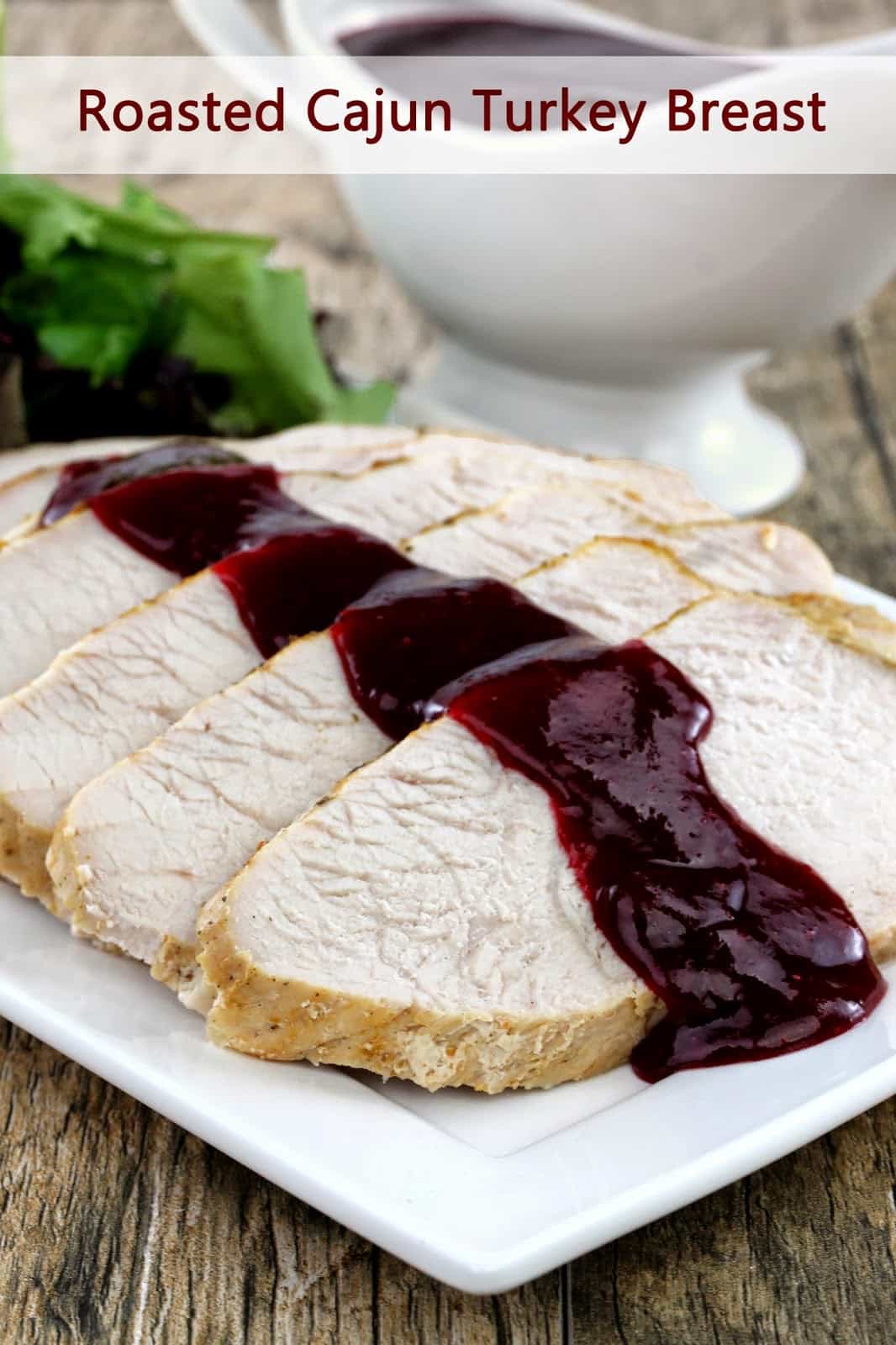 Slices of turkey breast drizzled with cranberry sauce