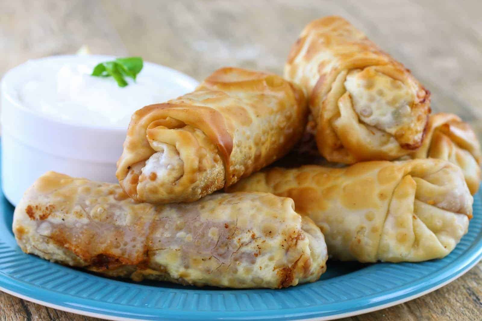Mexican Eggrolls on a blue plate.