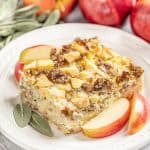 Slice of Sausage Breakfast Strata with Sage and Apple on a white plate.