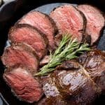 Bird's eye view of Beef Tenderloin in a cast-iron skillet.