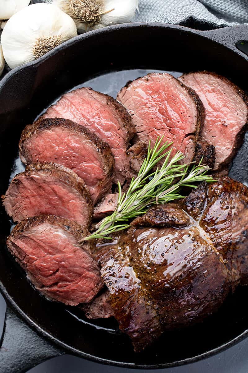 Bird's eye view of Beef Tenderloin in a cast-iron skillet.