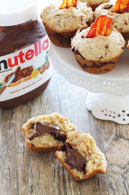 A bacon nutella muffin that has been split in half to reveal the nutella in the center.