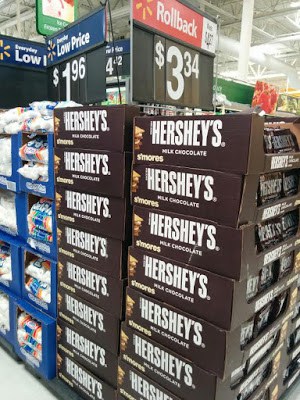 Tall stacks of boxes of Hershey's milk chocolate bars and marshmallows in Walmart's s'mores section