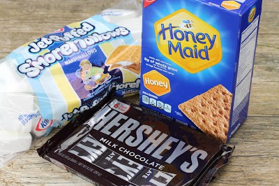 The s'mores basics: a bag of marshmallows, a box of graham crackers and a bag of Hershey's milk chocolate bars