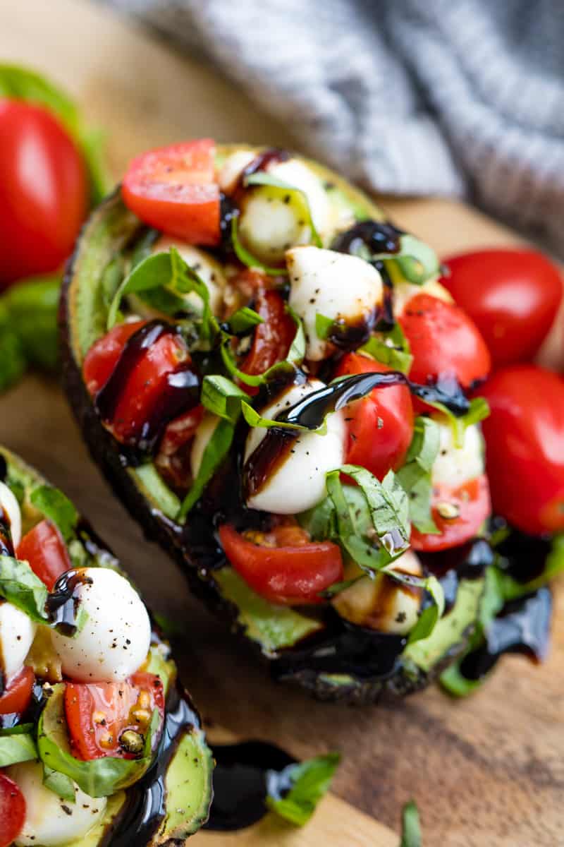 Caprese Stuffed Avocados have all the flavors of caprese you love stuffed into an avocado Caprese Stuffed Avocados