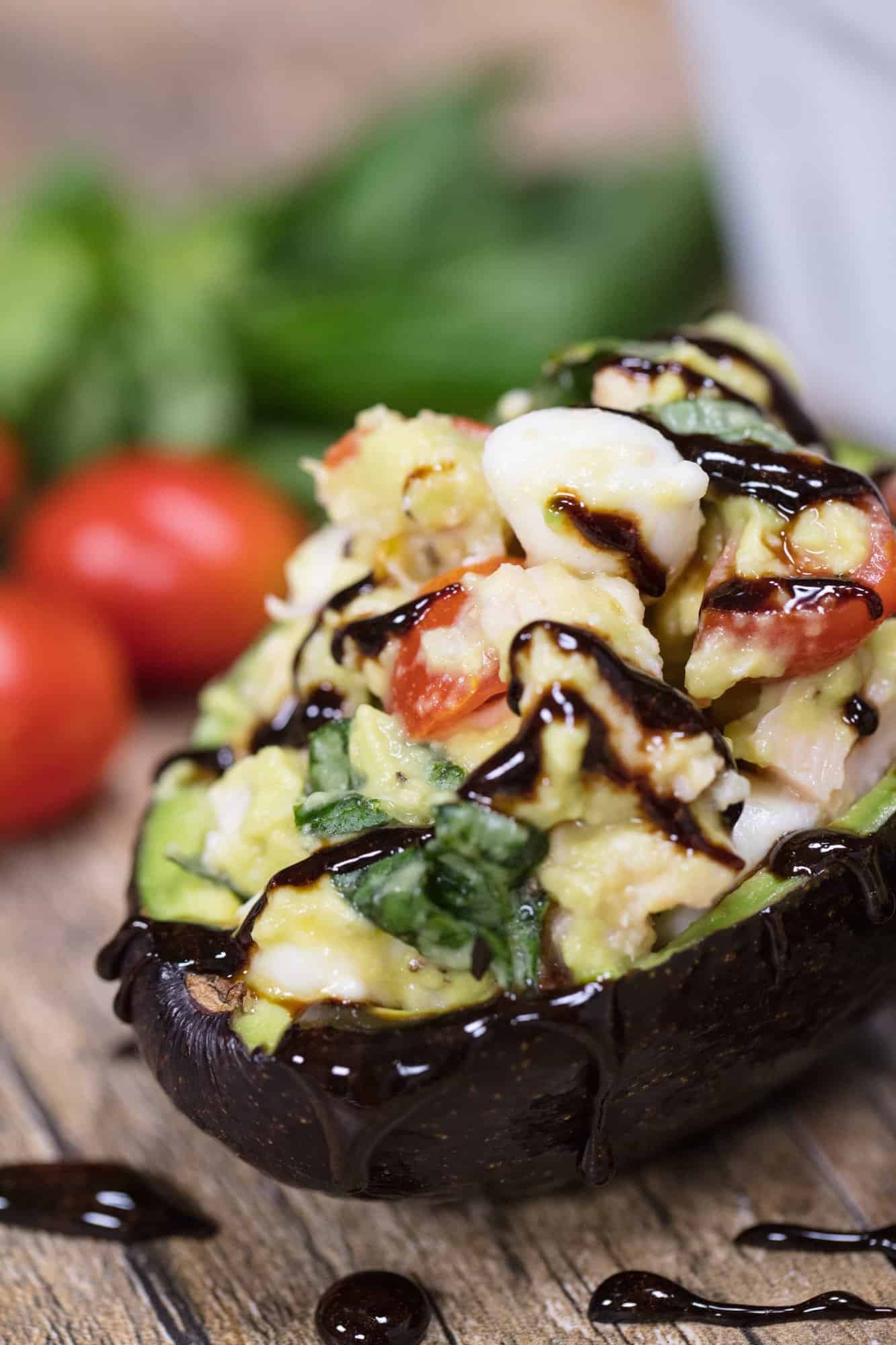Caprese Stuffed Avocados have all the flavors of caprese you love stuffed into an avocado. It's an easy and healthy lunch that will quickly become one of your favorites.