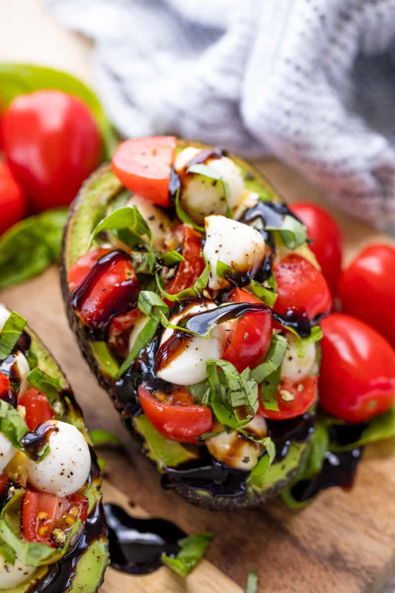 Caprese Stuffed Avocado on cutting board