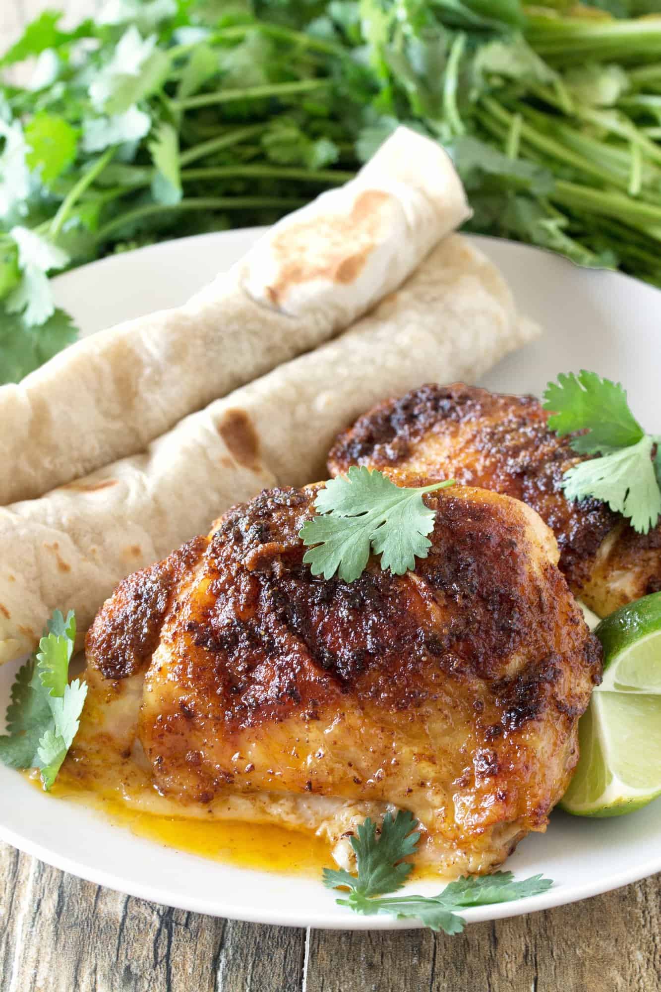 Mexican-Spiced Chicken Thighs take less than 5 minutes to get in the oven and are amazing served up with warm tortillas. It's an easy and delicious dinner!