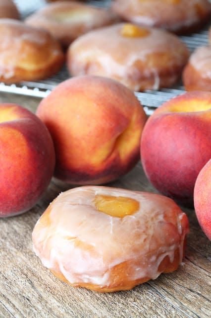 Peach pie donuts with fresh peaches